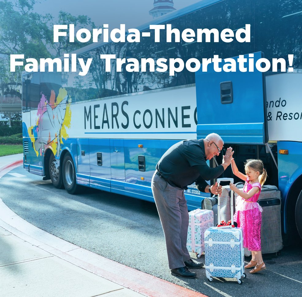 Mears Motorcoach operator high-fives a young girl in a pink dress beside a blue & while Mears Connect bus